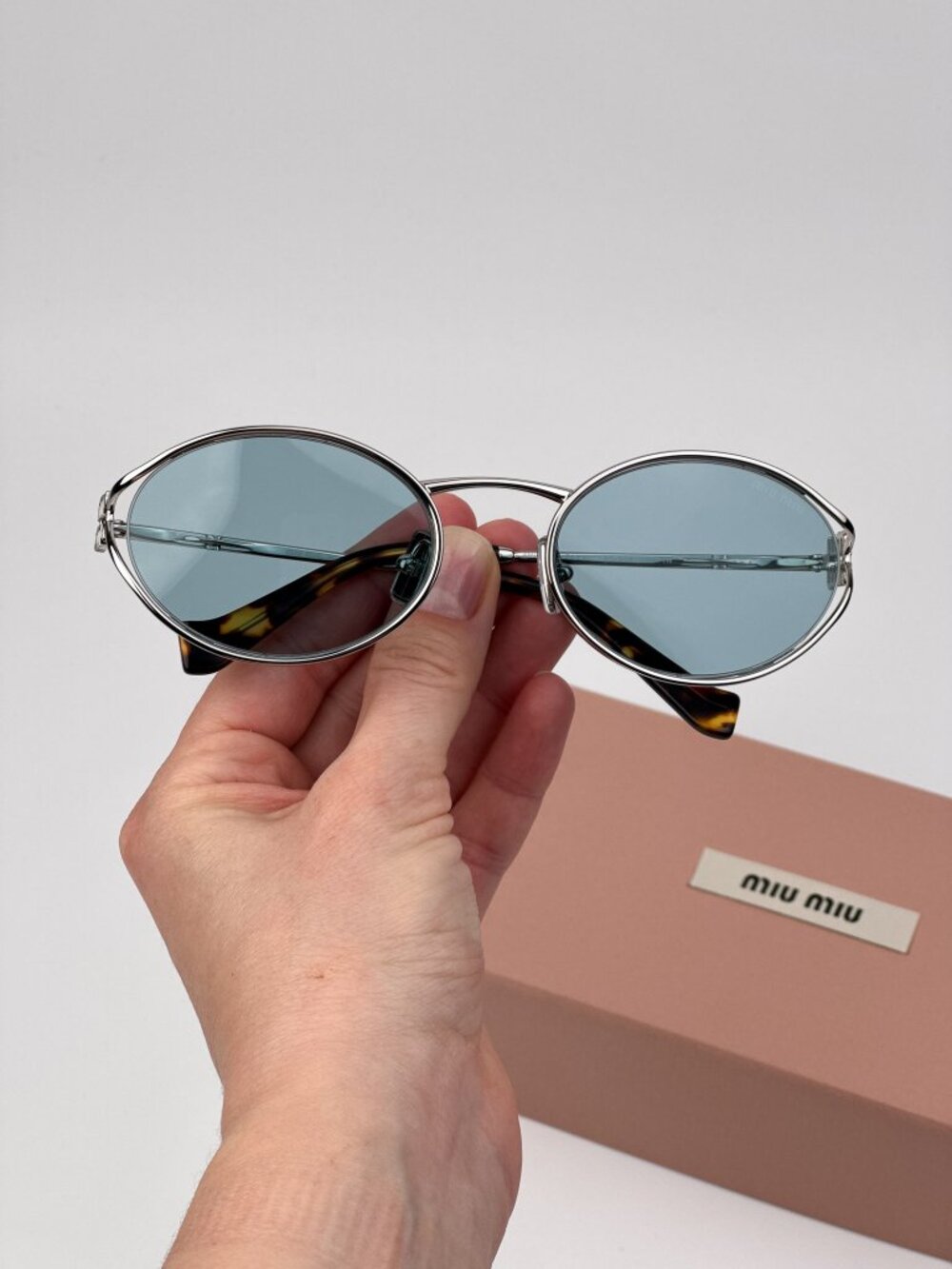 Miu Miu Women’s Sunglasses – LOGO Silver Blue Oval MU52YS 1BC20R New & Authentic